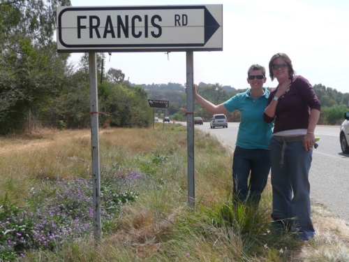 Karin and I commemorate Francis, who brought us together. I nearly fell into the ditch, hence the leaning.